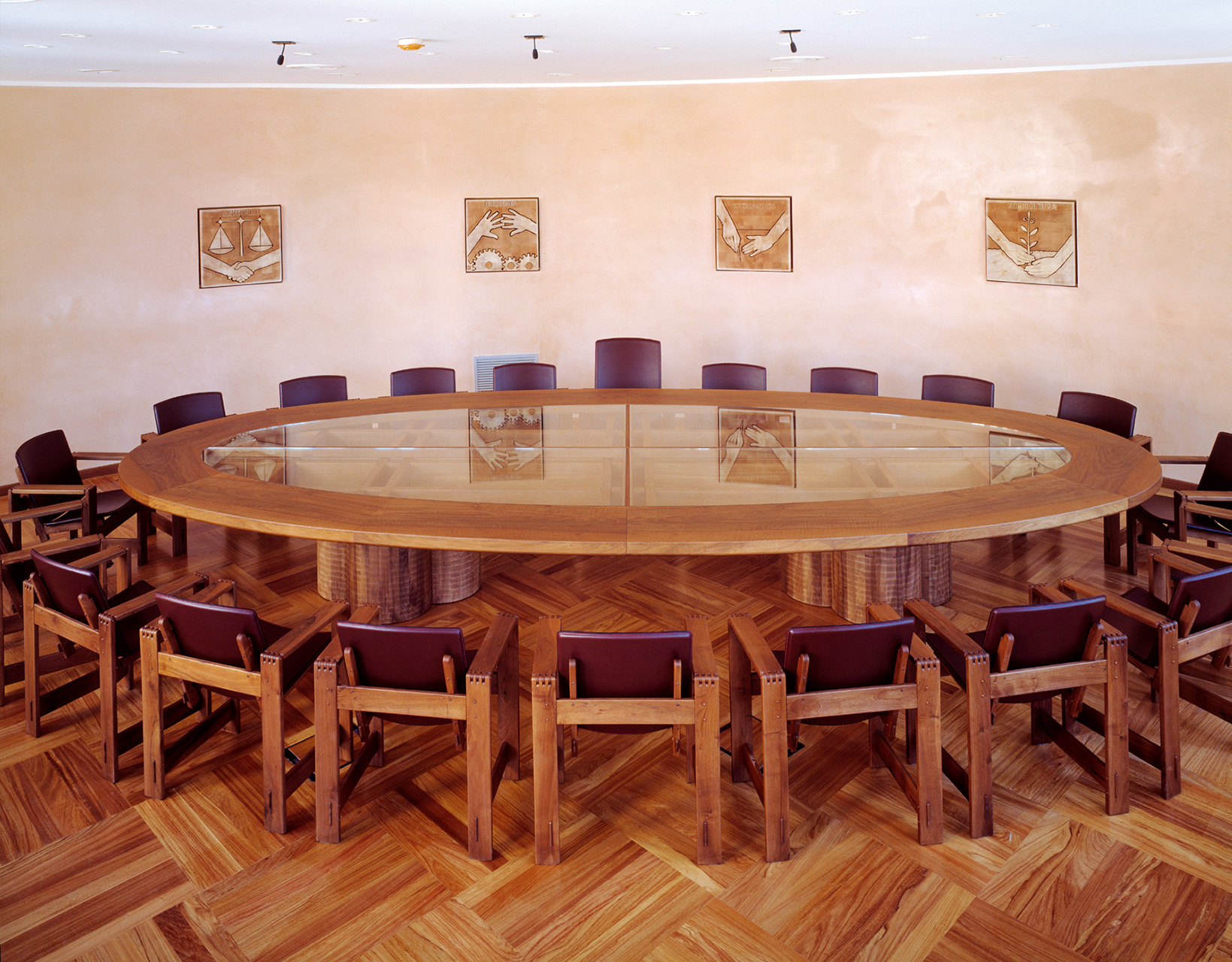 Conference table in Italian walnut with glass top, made to measure. San Marco armchairs in walnut with leather seats.