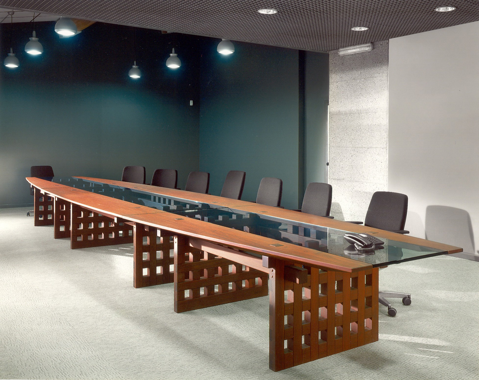 Conference table in paduak wood. Design by Nester Piotrowski.