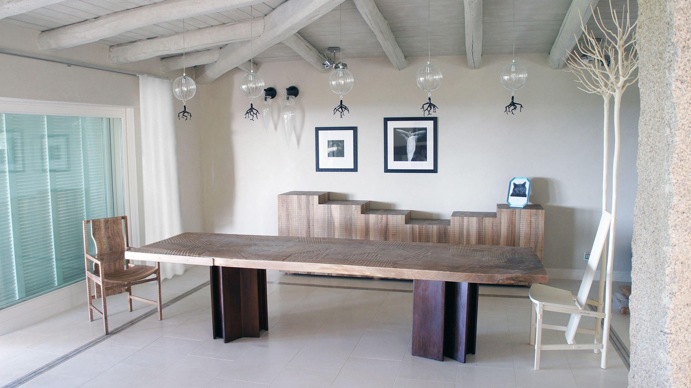 Bespoke table with corten steel legs and Italian walnut top. Nova dresser in Italian walnut Pisana armchair in Italian walnut. Fiorita chair in maple.