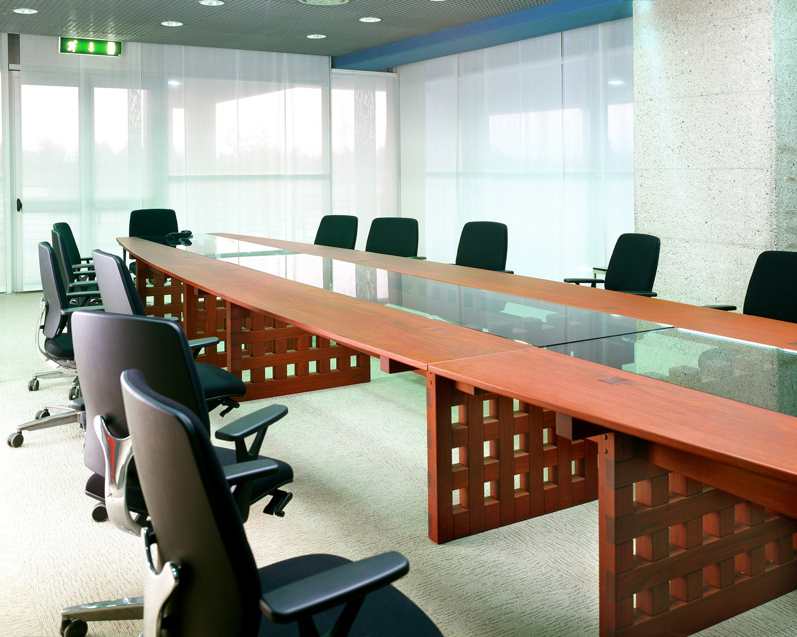 Conference table in paduak wood.