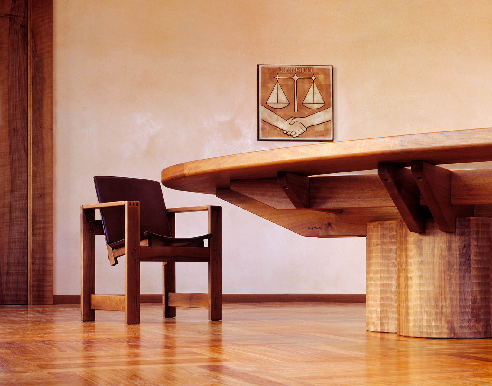 Conference table in Italian walnut with glass top, made to measure. San Marco armchairs in walnut with leather seats.