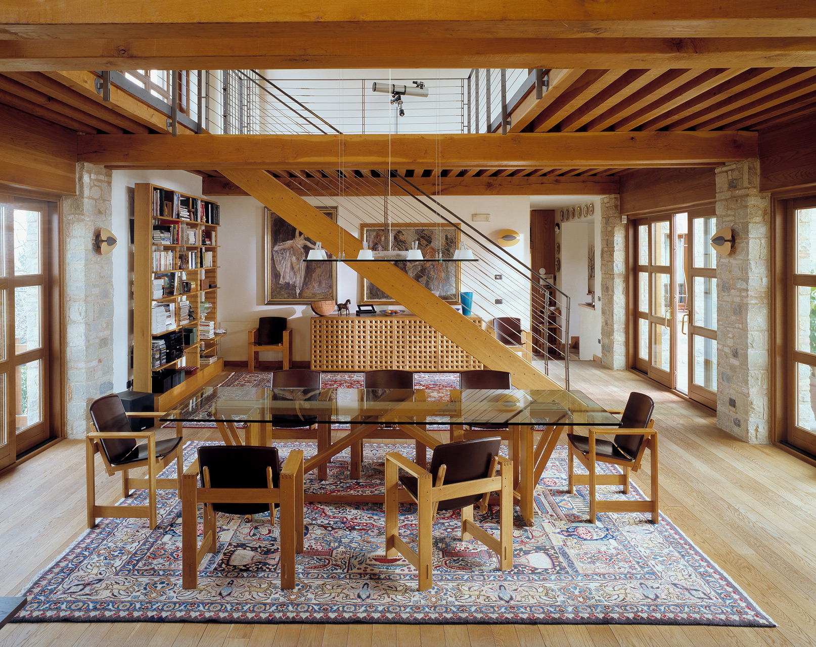 Lombardo table in oak with glass top. San Marco armchairs in oak with leather seats. Bespoke staircase in oak.