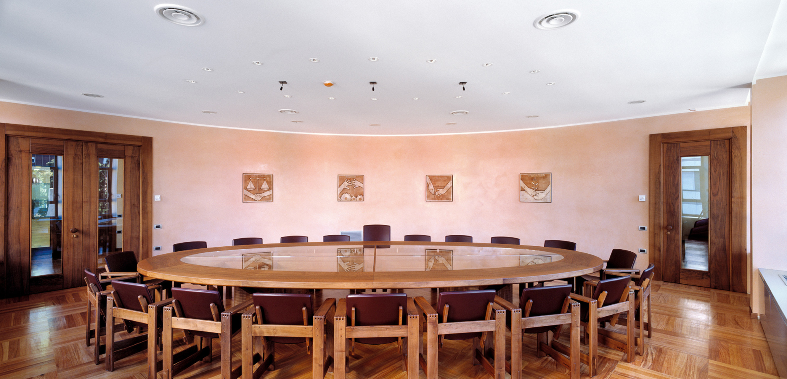 Conference table in Italian walnut with glass top, made to measure. San Marco armchairs in walnut with leather seats.