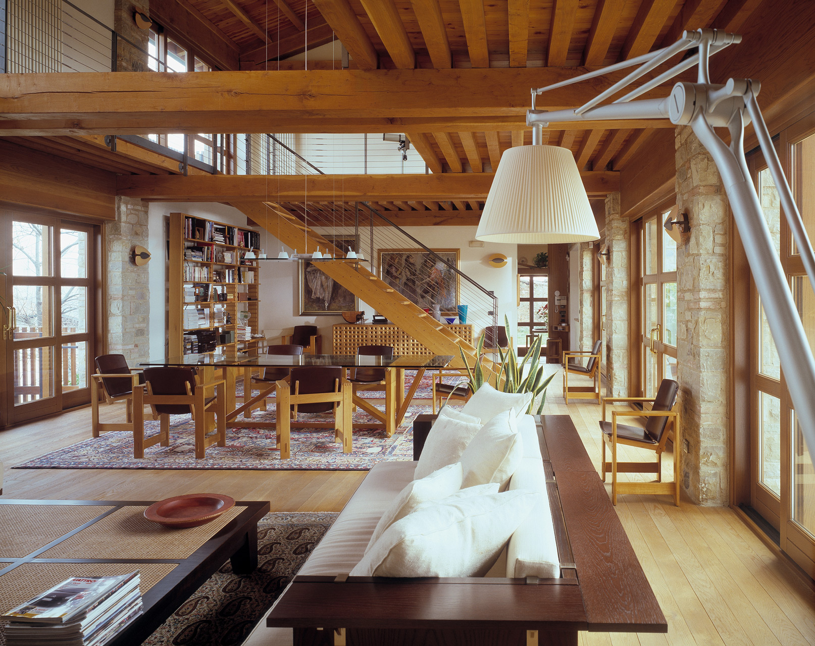 Lombardo table in oak with glass top. San Marco armchairs in oak with leather seats. Bespoke staircase in oak.