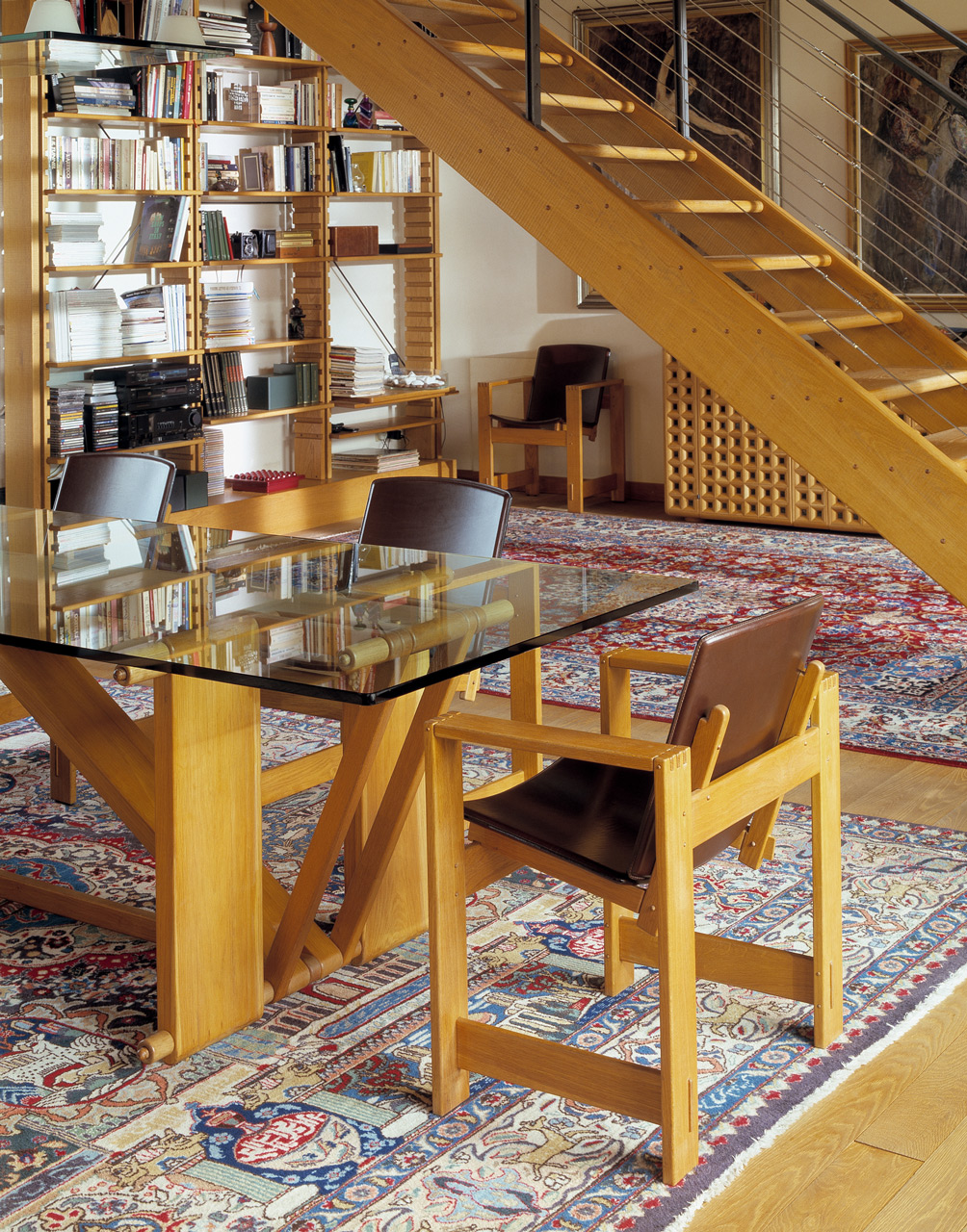 Lombardo table in oak with glass top. San Marco armchairs in oak with leather seats. Bespoke staircase in oak.