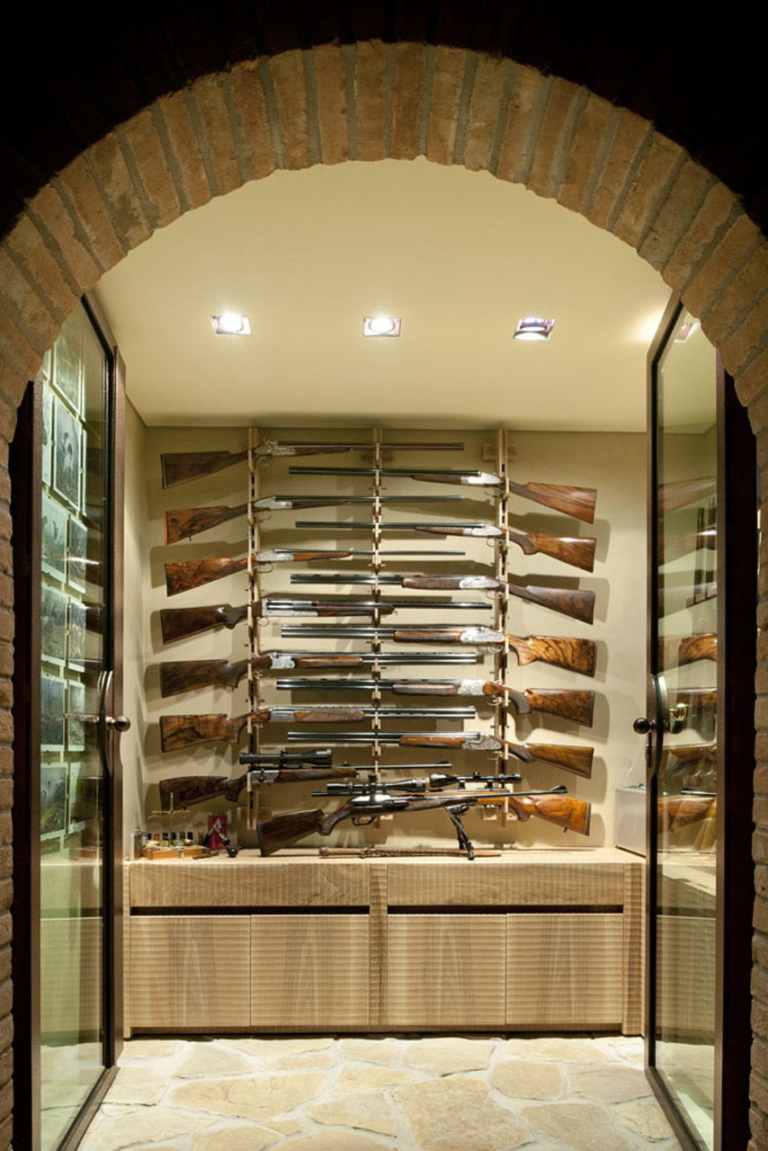 Gun rack and cupboard in Italian walnut.