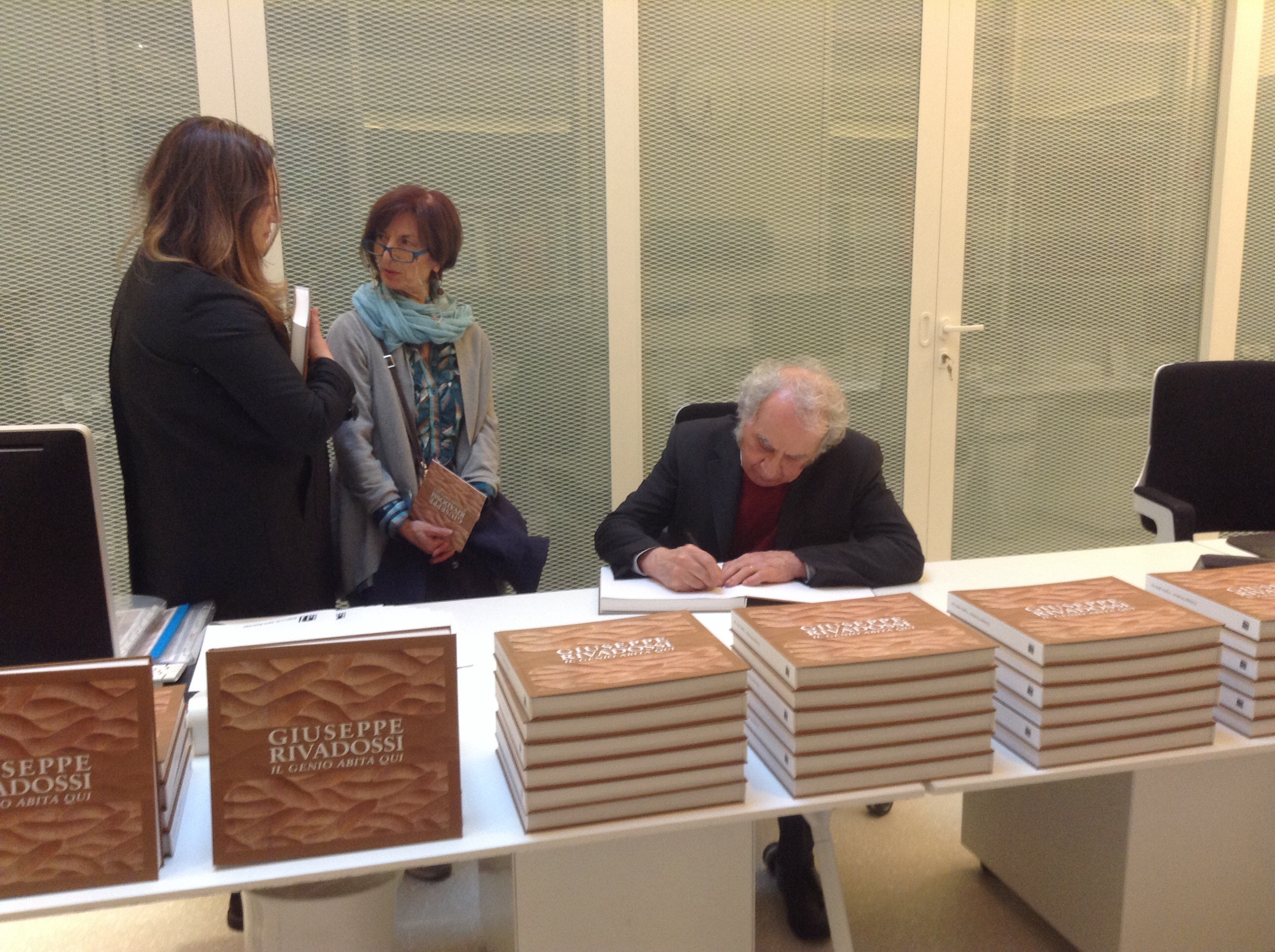 Giuseppe Rivadossi signing catalogues